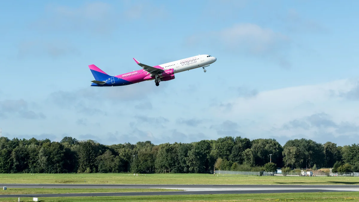 Wizz Air aircraft departing an airport